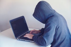 Man hacking into computer_AutoRABIT