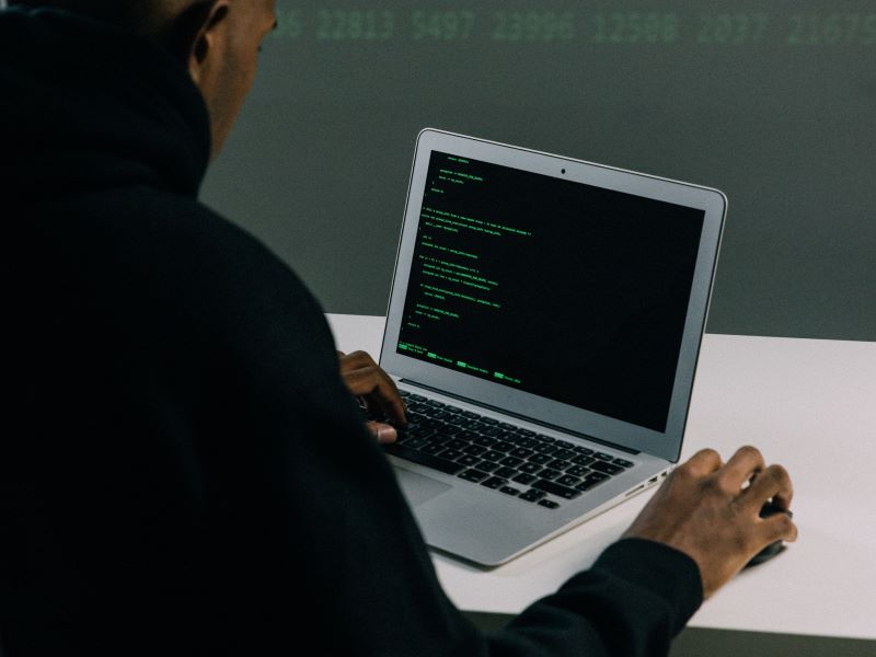man coding on a computer_AutoRABIT