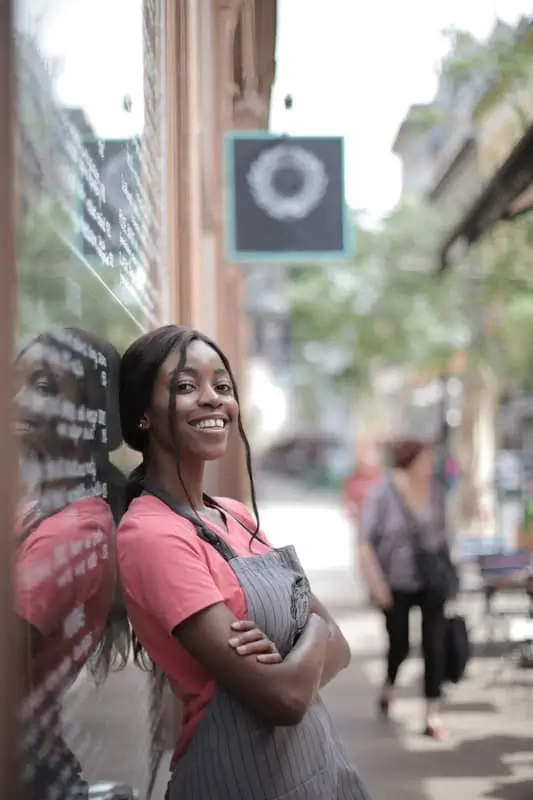 How-Banks-Can-Use-Metadata-to-Improve-Customer-Experience-1 Happy woman outside business_AutoRABIT