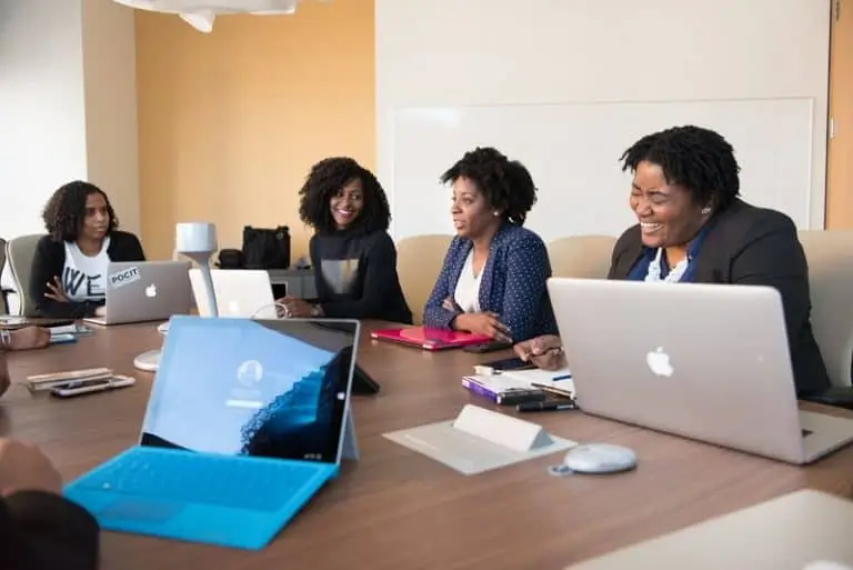 How-Banks-Can-Use-Metadata-to-Improve-Customer-Experience-3-768x513-1 Women in a meeting around a table with computers_AutoRABIT
