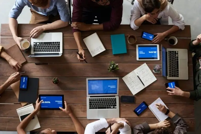 How-to-Remain-Secure-Without-Sacrificing-Quality-in-Salesforce-2-768x513 Discussion around table with computers_AutoRABIT