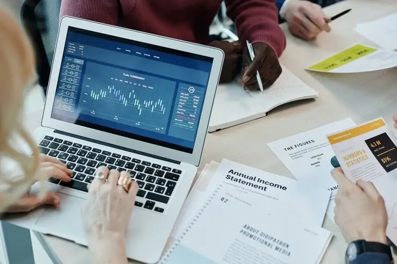 How-to-Remain-Secure-Without-Sacrificing-Quality-in-Salesforce-3 Analyzing data on a computer_AutoRABIT