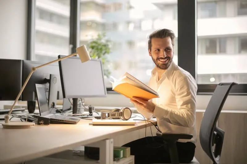 Why-Financial-Institutions-Shoul-1 Happy man at computer_AutoRABIT