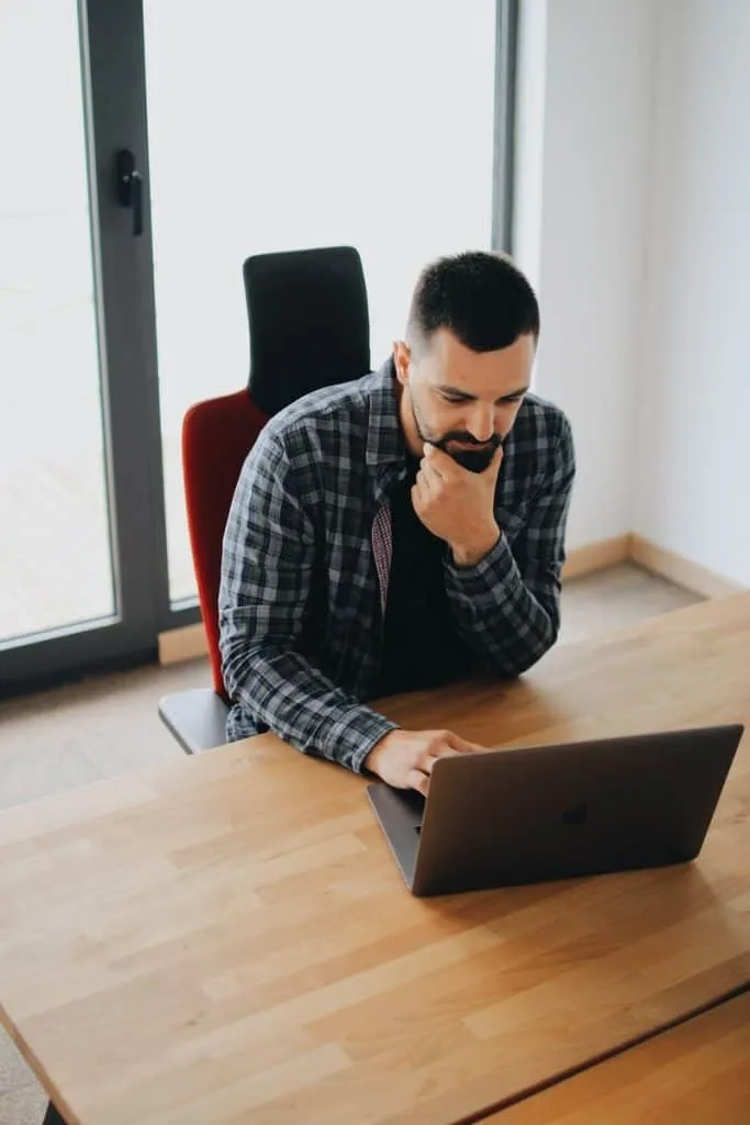 Do-I-Need-a-Salesforce-Release-Management-Tool-3 Man using computer_AutoRABIT