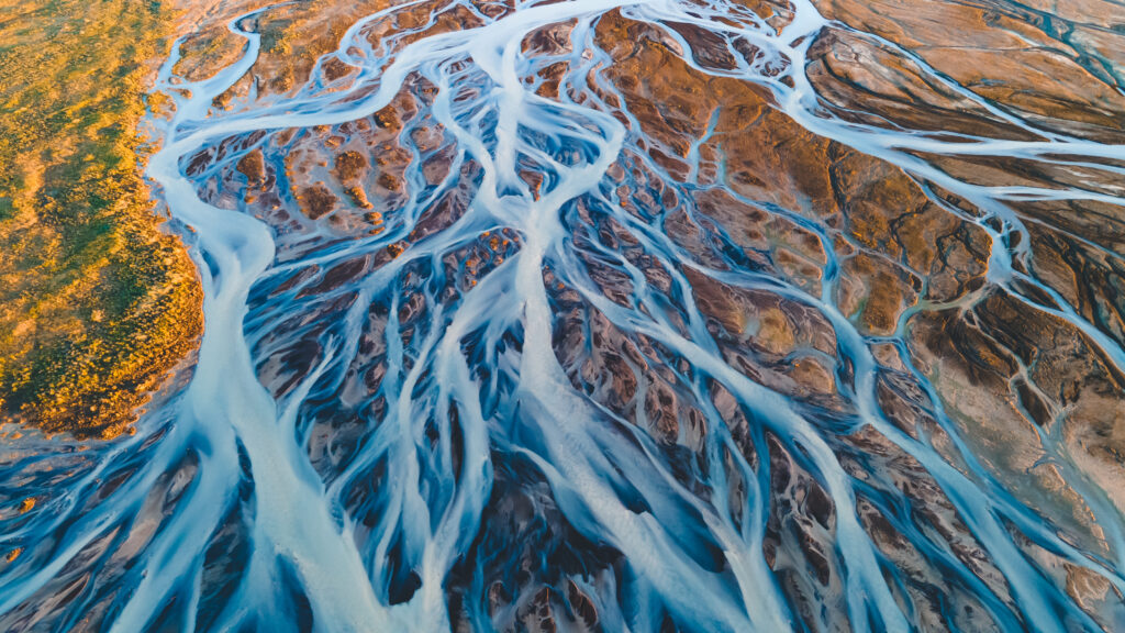 A glacial rivers from above. Aerial photograph of the river streams from Icelandic glaciers. Beautiful art of the Mother nature created in Iceland. Wallpaper background high quality photo CSPM vs SSPM What Matters for Salesforce Security_AutoRABIT